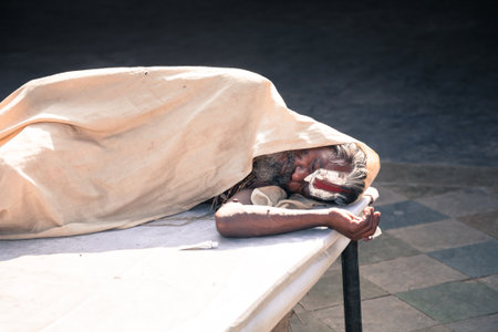 Jaipur, India - 2014, December 29 : An Indian holy man sleeping inside a Hindu temple on Choti Chaupar square in the city of Jaipur, also known as the Pink City in Rajasthan, Indiaのeditorial素材