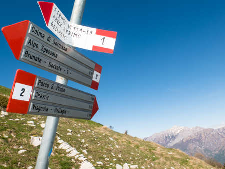 Signs indicating walking trails in the hills between Bellagio and Como in Lombardy, Italia