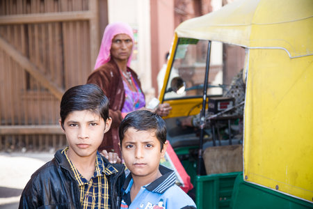 Jodhpur, India - 2015, January 4 : Two young Indian kids posing outside for the camera with a selfconfident look in Jodhpurのeditorial素材