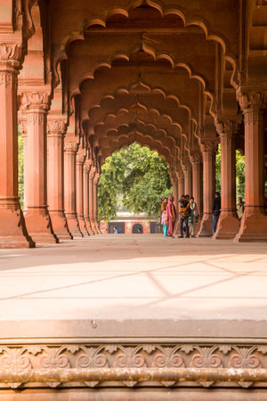Delhi, India - 2014, December 26 : Some people in a colonnade of red standstone decorated columns inside the Red Fort of Old Delhiのeditorial素材