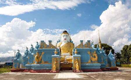 A big sitting buddha statue, said to be 700 years old, between the town of Nyaungshwe and the village of Nanthe on the Inle Lake of Myanmarの写真素材