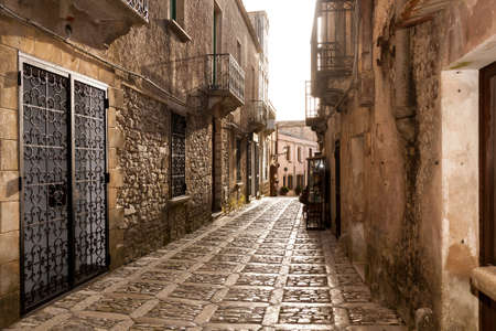 A cobbled medieval street in the historic town of Erice near Trapani in eastern Sicily, Italyの写真素材