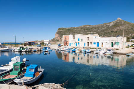 The fishing village of Punto Longa on the mediterranean island of Favignana which belongs to the Aegadian island archipelago of Sicily, Italyの写真素材