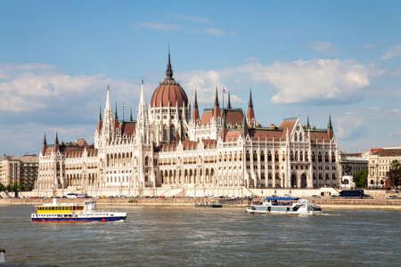 The famous parliament building of Budapest as seen from the river bank of the Buda area, Hungaryの写真素材