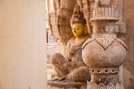 A historic ancient statue outside of the famous Buddhist temple of Ananda in Bagan, Burmaの写真素材