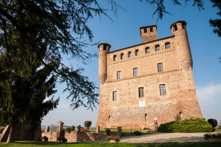 Grinzane Cavour, Italy - 2016, September 27 : The red brick castle of Grinzane Cavour in the Barolo Langhe area of the Piemonte region of northern Italyのeditorial素材
