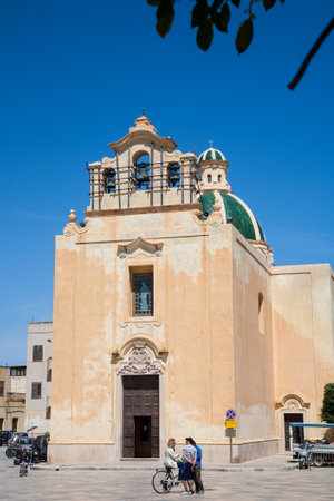 Favignana, Sicily - 2016, April 16 : The church of the Immaculate Conception in the center of the town of Favignana on the island with the same name with some people in frontのeditorial素材