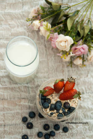 Chia Seeds and Milk topped with Blueberry, Strawberry and Cornflakes Cerealの写真素材