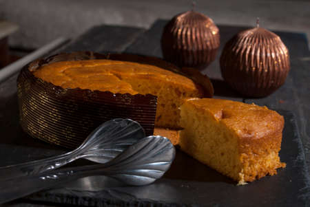 Carrot Cake with a Cup of Tea on a Wooden Table