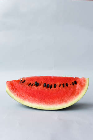 Watermelon Slice on a Gray Backgroundの写真素材