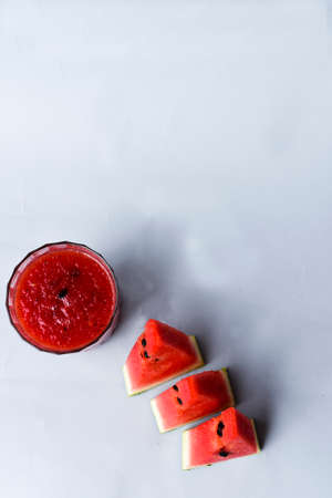 Watermelon Sliced with Watermelon Juice on a Gray Backgroundの写真素材