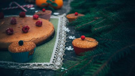 homemade christmas pie holiday dessert in new year tree decorations frame on vintage wooden table backgroundの写真素材