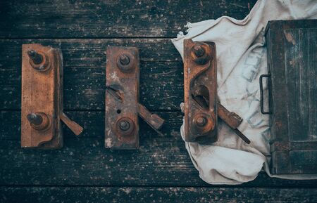 Old and rusty tools on a old board background. Flat lay and top viewの写真素材