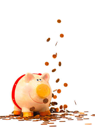 Piggy Bank and falling coins in the air,isolated on whiteの写真素材