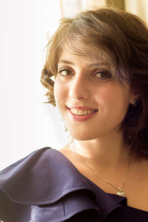 Portrait of the pretty natural brunette womanの写真素材