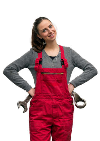 Happy female worker with big wrench, isolated on whiteの写真素材