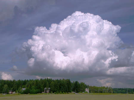 Big cloud above a rural landscapeの写真素材