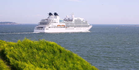 Cruise ship in Finland Gulf with yellow flowers in the foreground, Suomenlinna Sveaborg Helsinkiの写真素材