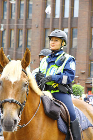HELSINKI, FINLAND - JUNE 30: Mounted police protect people taking part in the annual Helsinki Pride...