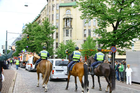 HELSINKI, FINLAND - JUNE 30: Mounted police protect people taking part in the annual Helsinki Pride gay parade in Helsinki, Finland on June 30, 2012. のeditorial素材