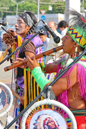MOSCOW, RUSSIA - JUNE 1: Native American Indian tribal group play music and sing in the street for...