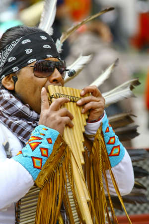 HELSINKI, FINLAND - MAY 1: Native American Indian tribal group play music and sing in the street for tourists and city dwellers on May 1, 2011 in Helsinki, Finlandのeditorial素材