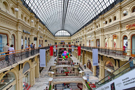MOSCOW - JULY 20: Inside the GUM department store in honor of 120th anniversary of the trading house GUM on July 20, 2013 in Moscow. There are about 200 stores, and it is very popular for international tourists.のeditorial素材