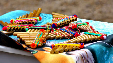 Native American colorful Andean flutes on artisan traditional product market
の写真素材