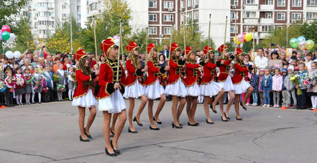 Moscow, Russia - September 1, 2015: School line is in schoolyard with pupils and teachers. Children go back to school. The Knowledge Day in Russia, first day of school.のeditorial素材