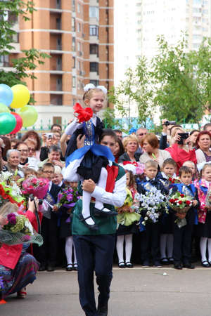 Moscow, Russia - September 1, 2015: School line is in schoolyard with pupils and teachers. Children go back to school. The Knowledge Day in Russia, first day of school.のeditorial素材