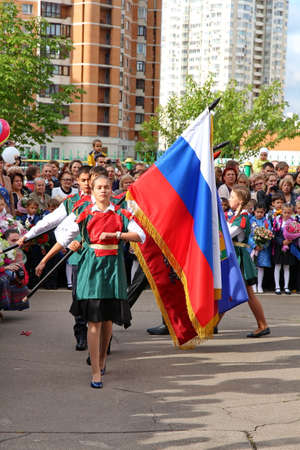 Moscow, Russia - September 1, 2015: School line is in schoolyard with pupils and teachers. Children go back to school. The Knowledge Day in Russia, first day of school.のeditorial素材