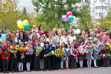 Moscow, Russia - September 1, 2015: School line is in schoolyard with pupils and teachers. Children go back to school. The Knowledge Day in Russia, first day of school.のeditorial素材