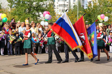 Moscow, Russia - September 1, 2015: School line is in schoolyard with pupils and teachers. Children go back to school. The Knowledge Day in Russia, first day of school.のeditorial素材