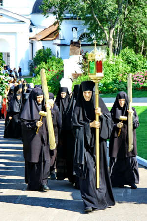 MALOYAROSLAVETS, RUSSIA - AUGUST 19, 2012: Nuns take part in the religious procession in Monastery of St. Nicholas in the ancient Russian city Maloyaroslavets. For editorial use only.のeditorial素材