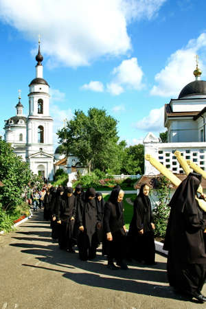 MALOYAROSLAVETS, RUSSIA - AUGUST 19, 2012: Nuns take part in the religious procession in Monastery...