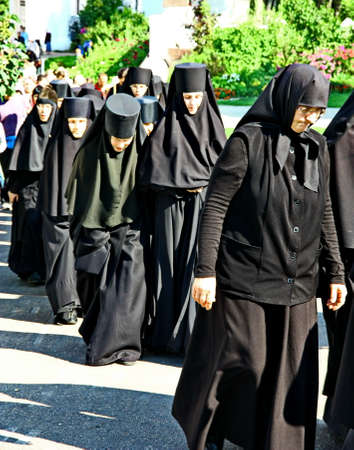 MALOYAROSLAVETS, RUSSIA - AUGUST 19, 2012: Nuns take part in the religious procession in Monastery of St. Nicholas in the ancient Russian city Maloyaroslavets. For editorial use only.のeditorial素材