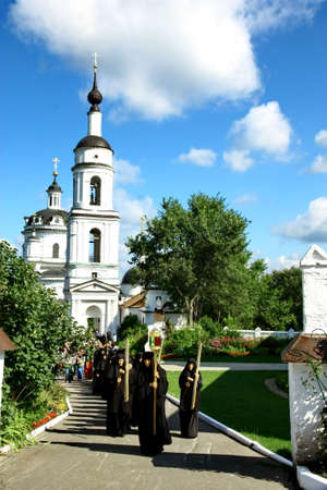 MALOYAROSLAVETS, RUSSIA - AUGUST 19, 2012: Nuns take part in the religious procession in Monastery...