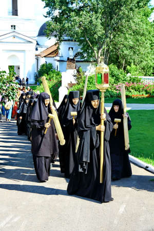 MALOYAROSLAVETS, RUSSIA - AUGUST 19, 2012: Nuns take part in the religious procession in Monastery...