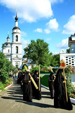 MALOYAROSLAVETS, RUSSIA - AUGUST 19, 2012: Nuns take part in the religious procession in Monastery...