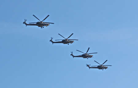 MOSCOW, RUSSIAN - MAY 9, 2013: Demonstration flight of military helicopters, a parade dedicated to the Soviet victory over Germany. For editorial use only.のeditorial素材