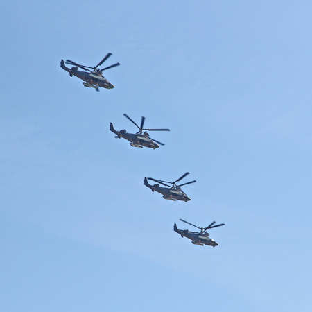 MOSCOW, RUSSIAN - MAY 9, 2013: Demonstration flight of military helicopters, a parade dedicated to the Soviet victory over Germany. For editorial use only.のeditorial素材