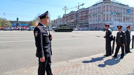 MOSCOW, RUSSIAN - MAY 9, 2013: Policemen in cordon wait for motorcade on TverskayaStreet on parade...