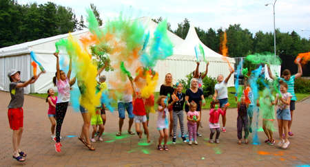 Moscow, Russia - July 14, 2018: Throwing color at the Holi color festival. Happy people during Festival of colours Holi. Holi is traditional holiday of India.のeditorial素材