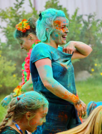 Moscow, Russia - July 14, 2018: Throwing color at the Holi color festival. Happy people during Festival of colours Holi. Holi is traditional holiday of India.のeditorial素材