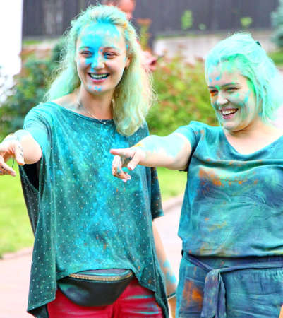 Moscow, Russia - July 14, 2018: Throwing color at the Holi color festival. Happy people during Festival of colours Holi. Holi is traditional holiday of India.のeditorial素材