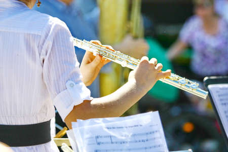 Flute music playing flutist musician performer with musical instrumentの写真素材
