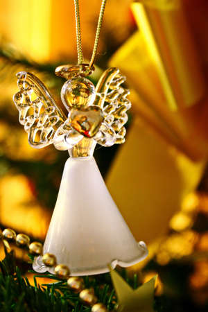 Toy glass angel decoration on the xmas treeの写真素材