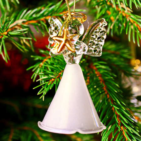 Toy glass angel decoration on the xmas treeの写真素材