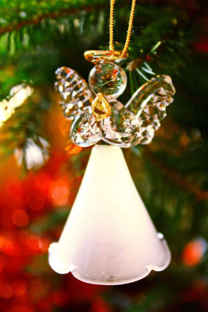 Toy glass angel decoration on the xmas treeの写真素材