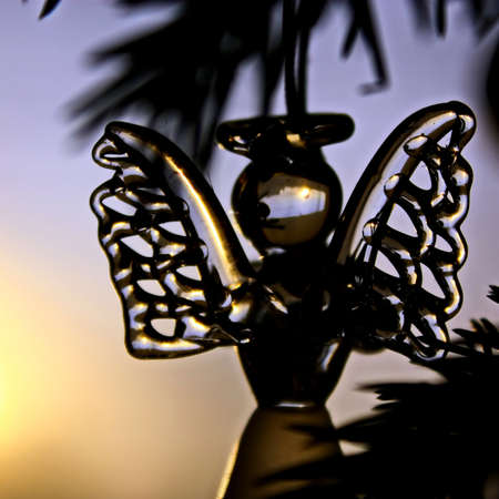 Toy glass angel decoration on the xmas treeの写真素材